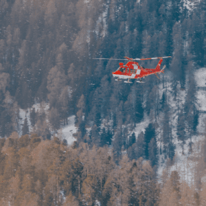 Helicopter in mountainous winter landscape