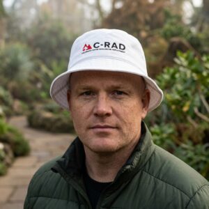 Man wearing white bucket hat with C-RAD logo.