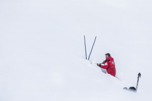 Avalanche tech digging in snow during training 